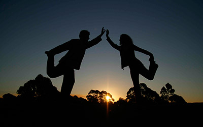 Natarajasana yoga posture at sunset