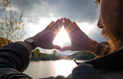 hands in akasha mudra with sunlight