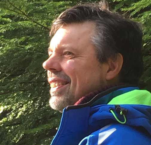 Andrew Wells, Dru Yoga teacher trainer, in trees in Betwys y Coed